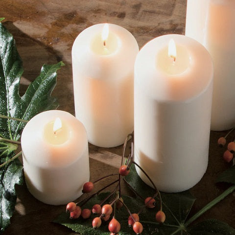 Velón cilíndrico de 15 x 7 cm.